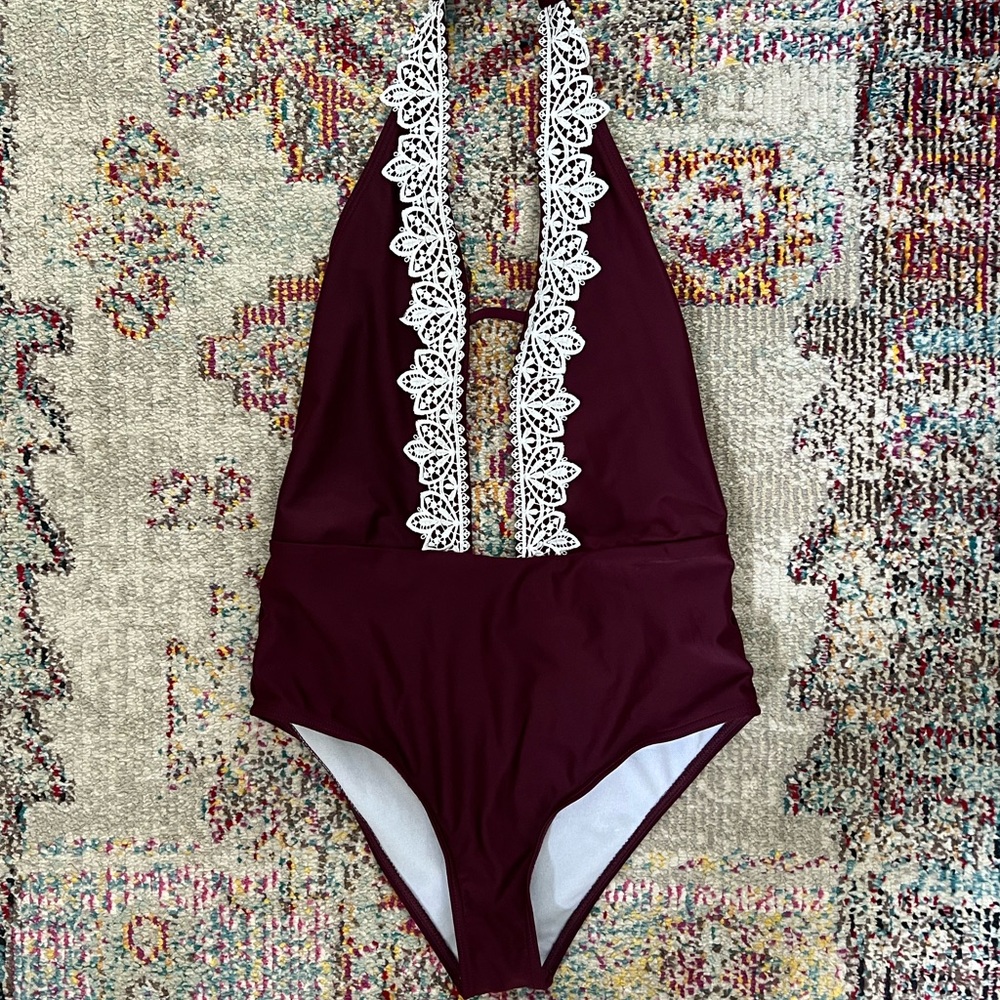 NWOT plunging halter one piece